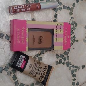 Lip gloss And Liquid Highlighter .. NO BRONZER. Middle Piece Sold. Getting 2